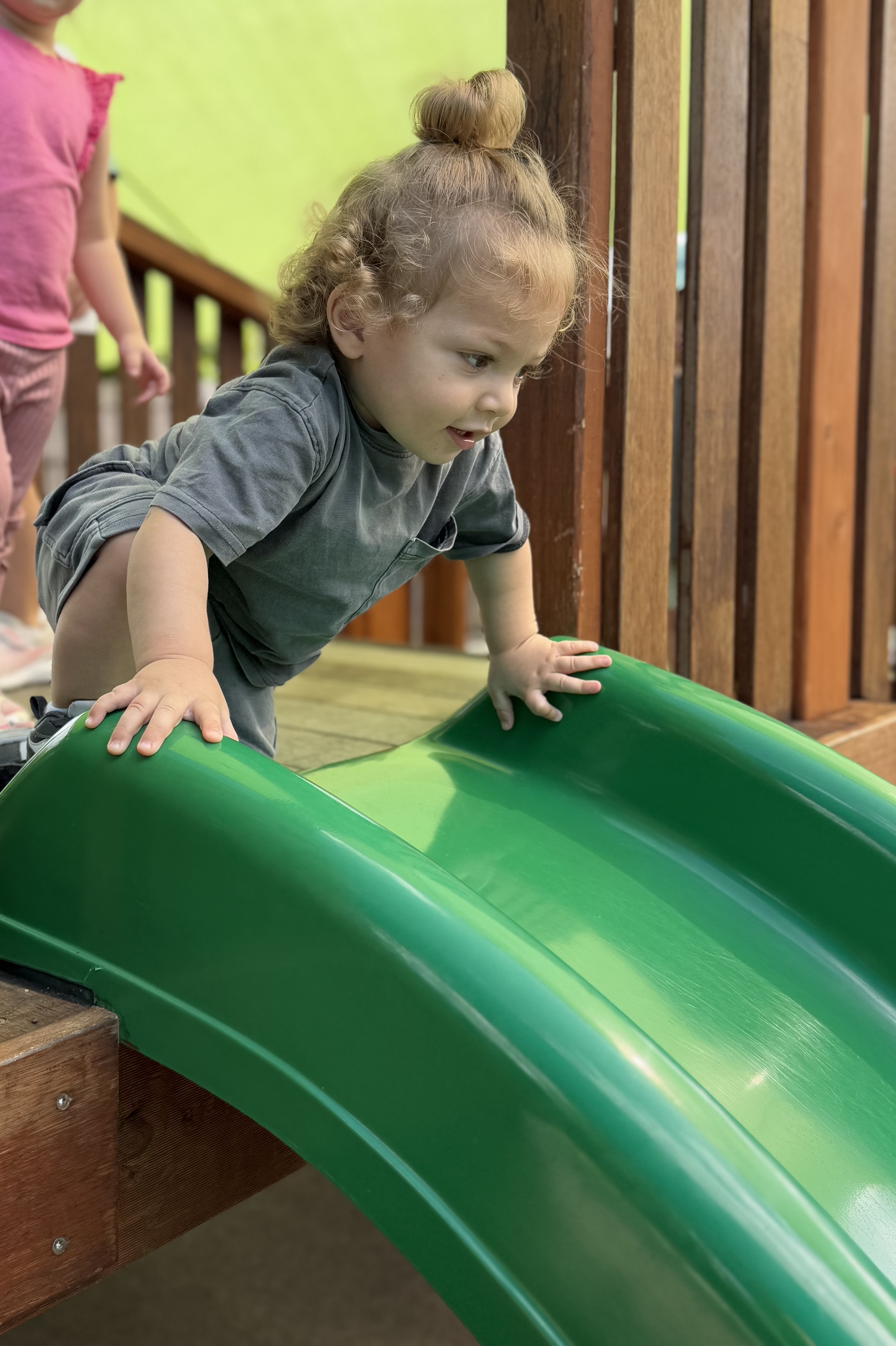 Happy child going down the slide